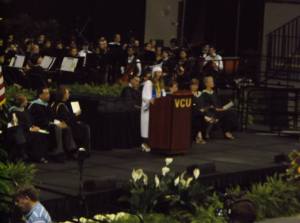 A blurry photo of me giving my speech at graduation.